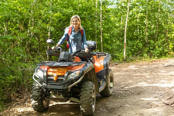 depositphotos_592296730-stock-photo-young-woman-quad-bike-trail